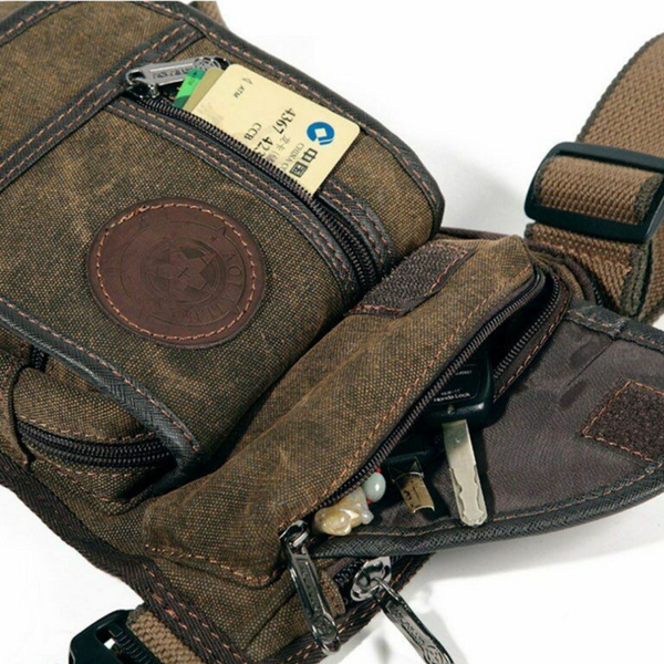 Brown canvas Fitlybuy waterproof leg bag with multiple zippered pockets, holding a credit card and keys.