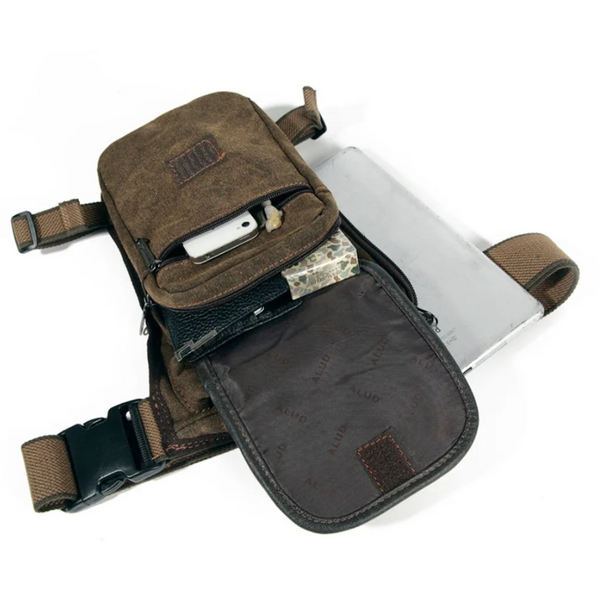 Brown waterproof canvas leg bag with adjustable straps, open pockets, and multiple compartments on a white background.