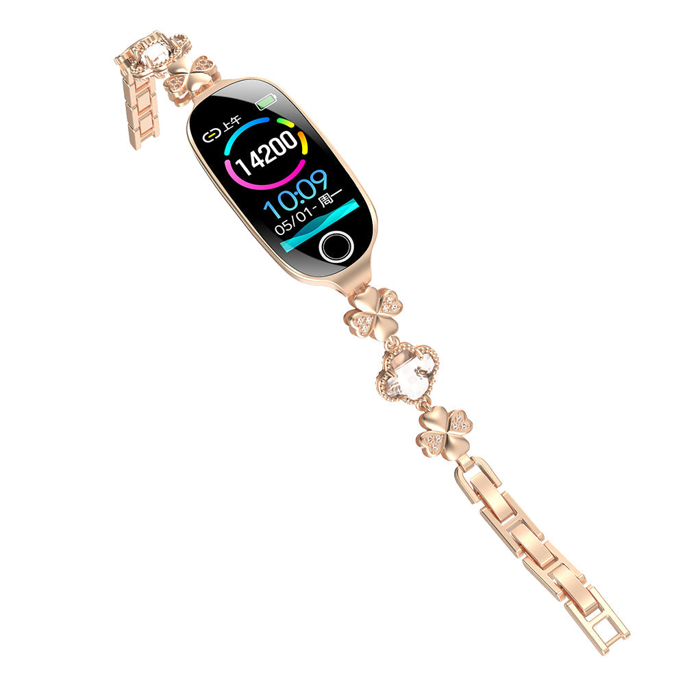 Rose gold Fitlybuy Kexi-Life smartwatch with clover-shaped, diamond-accented bracelet and digital health display.