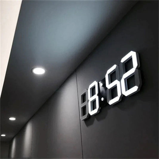 Fitlybuy PixelTime 3D LED digital wall clock showing time in bright white on a sleek, dark modern wall.