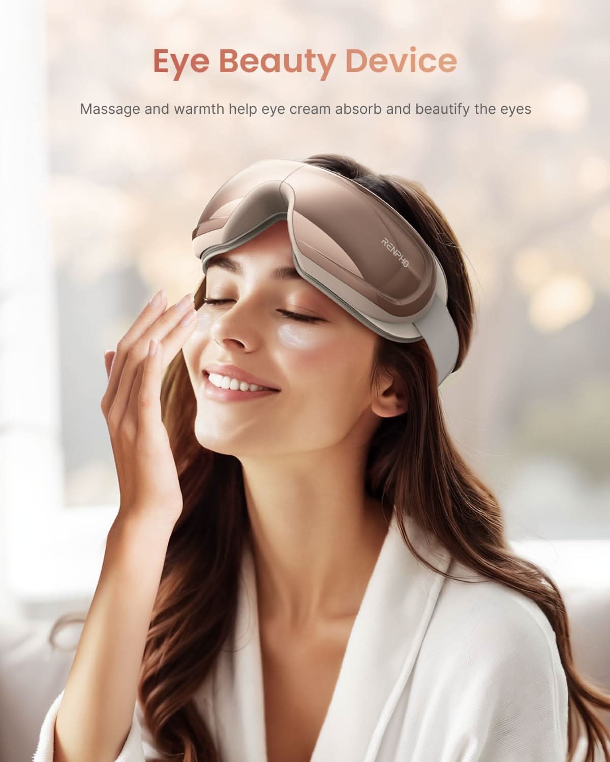 Woman wearing a rosé Fitlybuy Eyeris 3 eye massager with heat and vibration for beauty skincare.