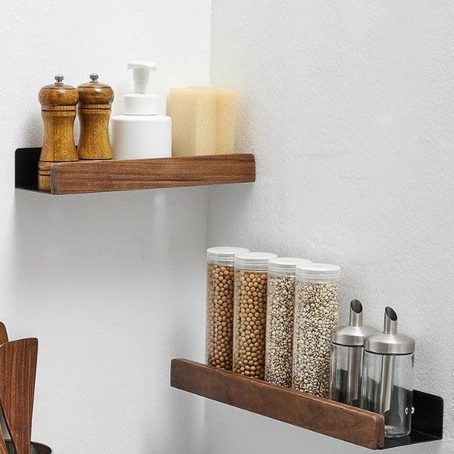 Fitlybuy solid wood and black metal wall-mounted shelves holding spices and kitchen accessories on a white wall.