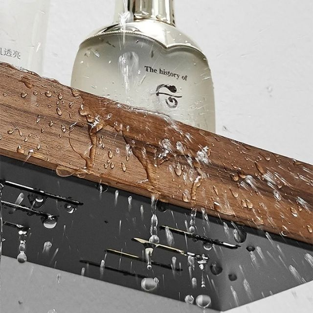 Fitlybuy solid wood and black metal bathroom shelf in a shower, water splashing on the organizer.