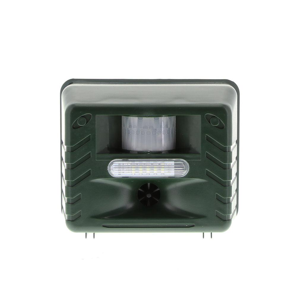 Dark green ultrasonic woodpecker repeller with motion sensor, LED flash, and speaker, isolated on white background.
