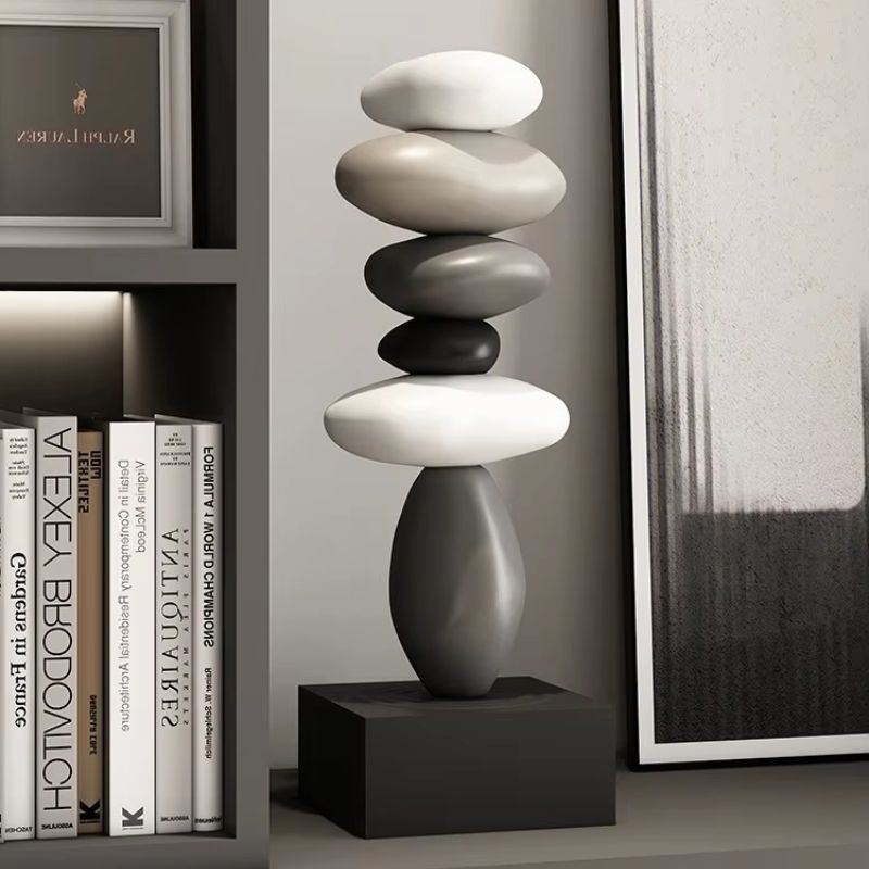 Fitlybuy Balanture Zen sculpture: a vertical stack of smooth, monochromatic stones on a black base, styled on a shelf.
