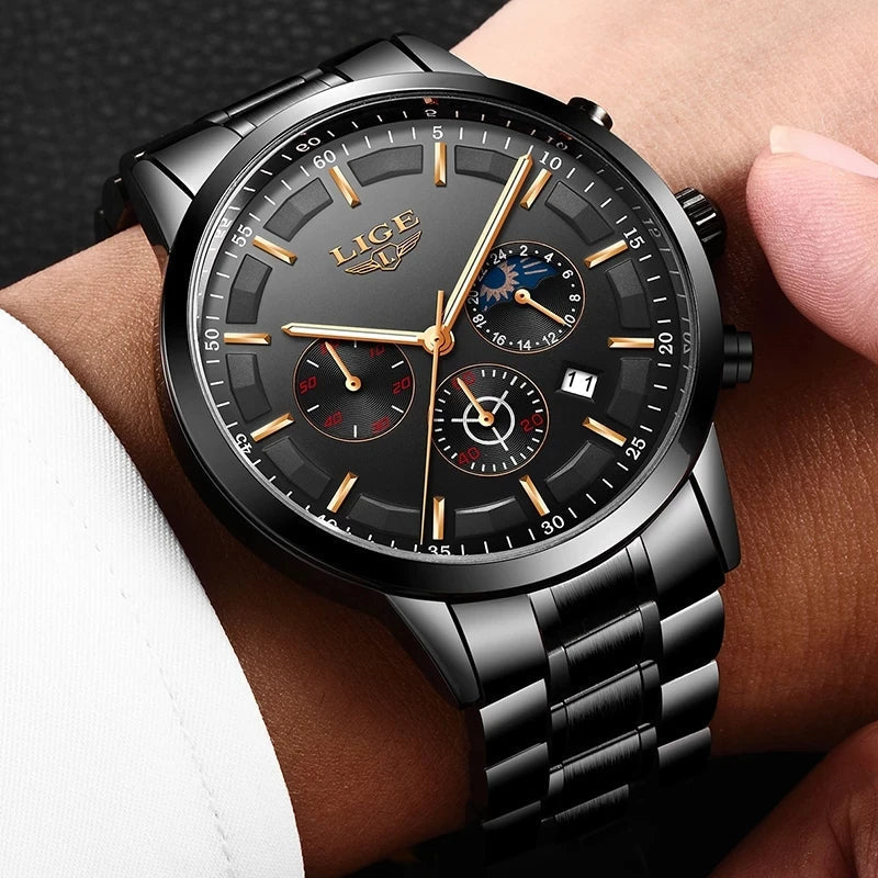 Fitlybuy VanguardTime black steel military watch with gold hands, moon phase dial, and chronograph on a man's wrist.