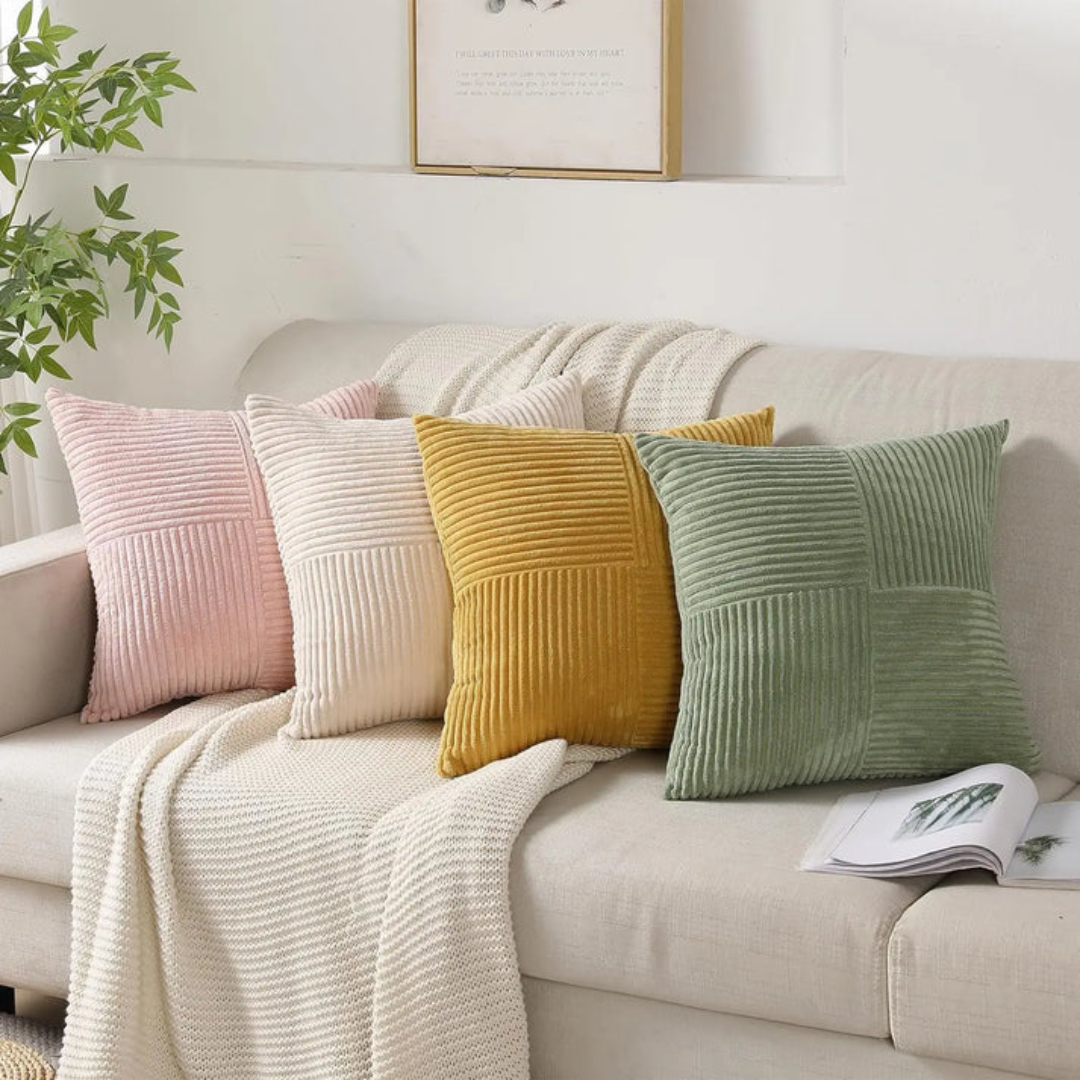 Four decorative Fitlybuy Volyx square cushions in pink, cream, yellow, and green, featuring striped plush textures.