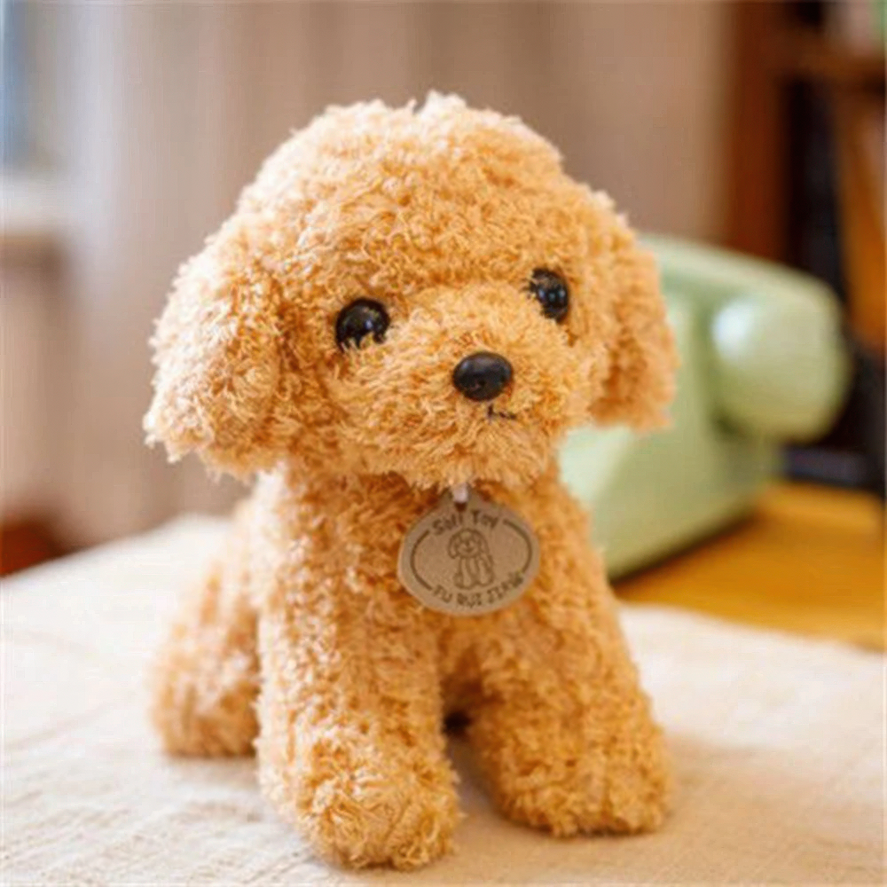 Fitlybuy plush teddy dog in tan, featuring soft curly fabric, black eyes, and a round tag, sitting on a table.