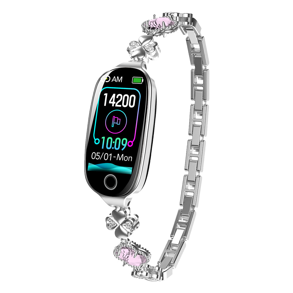 Silver luxury smartwatch with diamond-style clover links, pink accents, and a digital health tracking display.