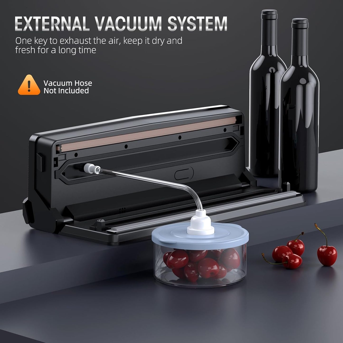 Black Fitlybuy 8-in-1 vacuum sealer with an open lid, connected to a clear canister of cherries via a suction hose.