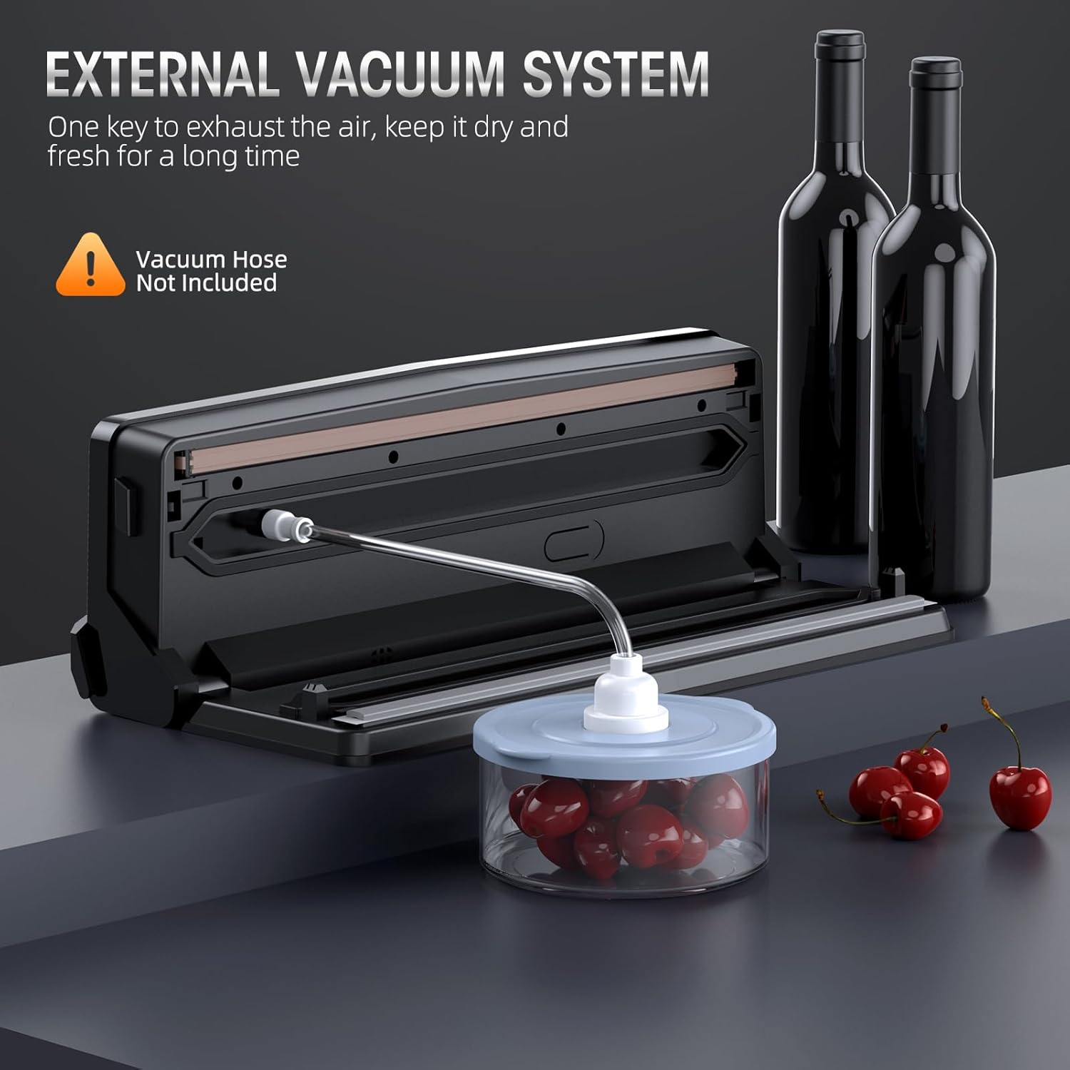 Black Fitlybuy 8-in-1 vacuum sealer with an open lid, connected to a clear canister of cherries via a suction hose.
