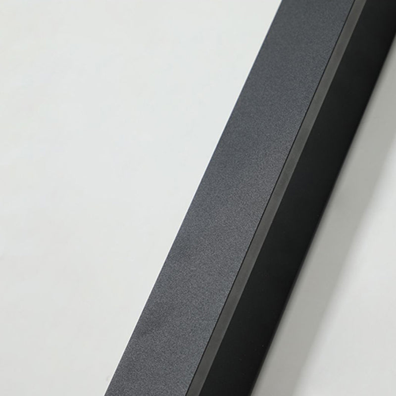 Close-up of a matte black, minimalist rectangular waterproof LED wall light against a plain white background.