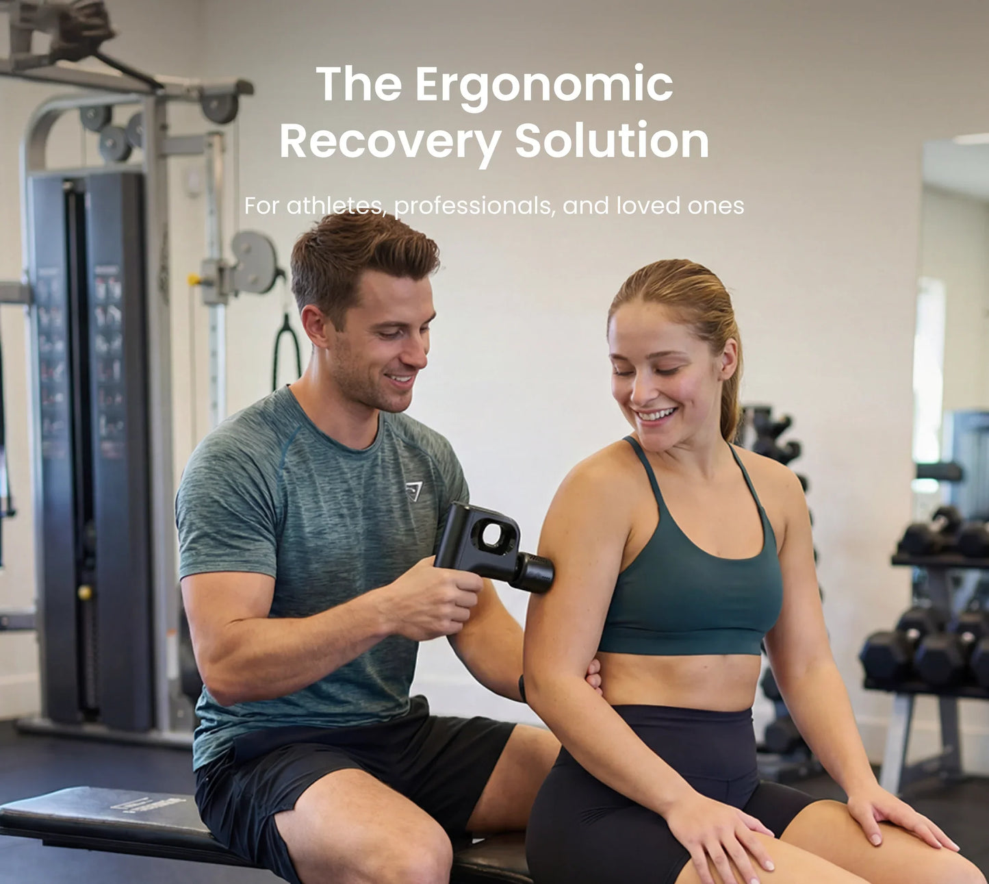 A man uses a compact black Fitlybuy Active Mini massage gun on a woman's shoulder in a gym setting.