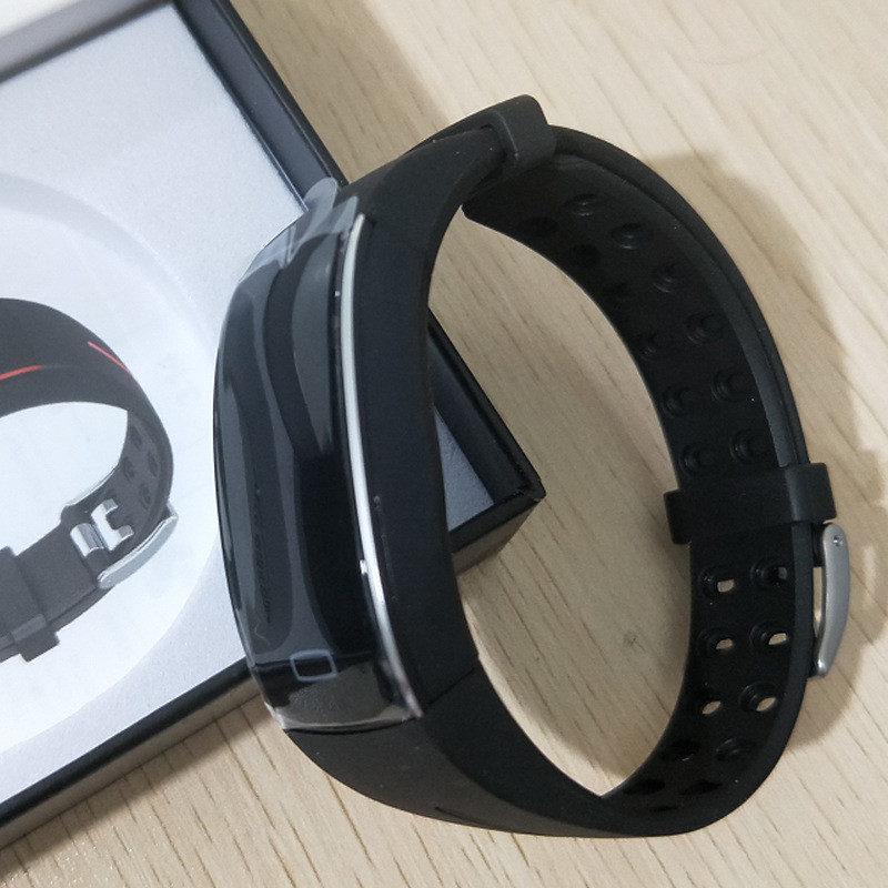 Fitlybuy SmartFit black Bluetooth smartwatch with a vented silicone strap, shown in its product box.