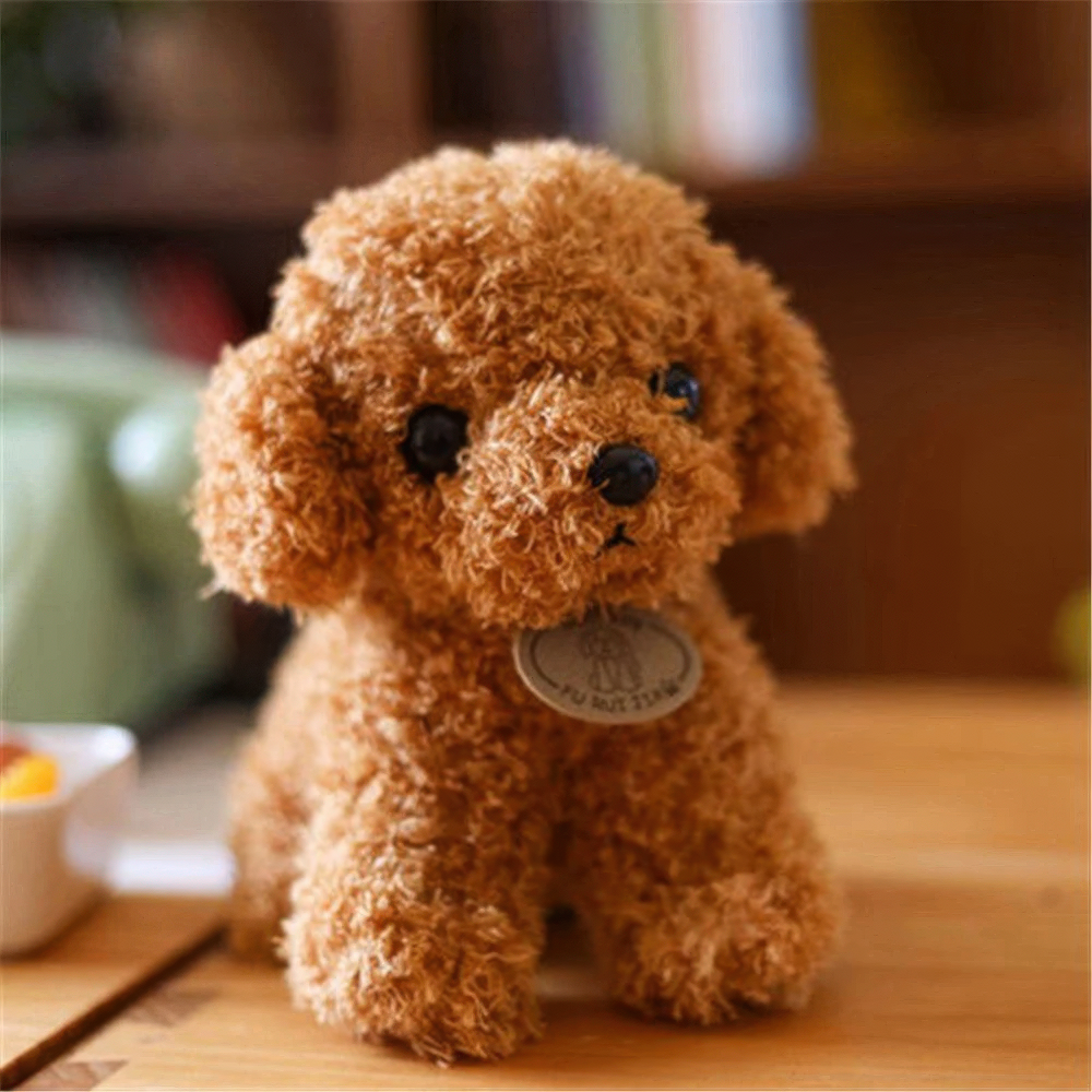 Fitlybuy brown, curly-haired plush teddy dog toy with black eyes and a small collar tag, sitting on a wooden surface.
