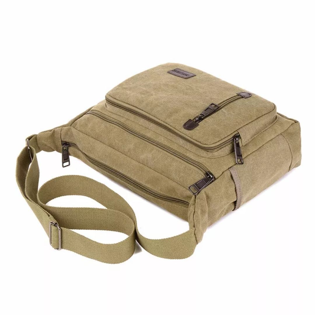Fitlybuy TravelPro olive green canvas shoulder bag with multiple zippered compartments and an adjustable strap.