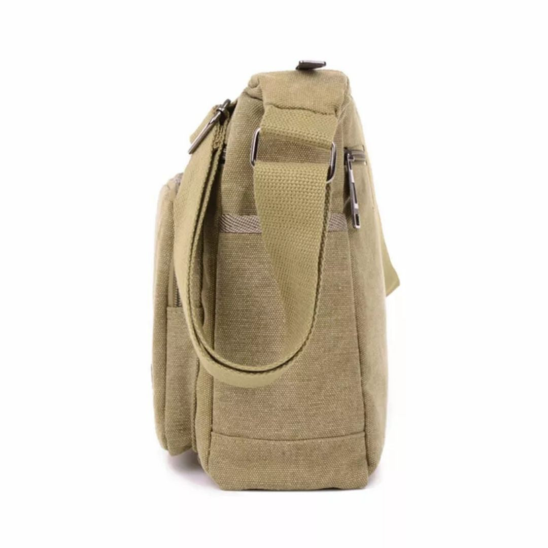 Side profile of a khaki canvas Fitlybuy TravelPro shoulder bag with a wide strap, side pocket, and zipper closures.