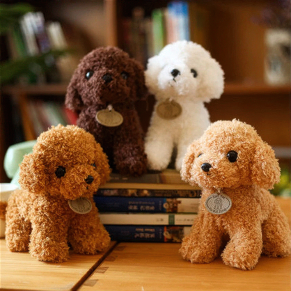 Four fluffy Fitlybuy plush teddy dogs in brown, white, and tan, sitting on a wooden desk near a bookshelf.