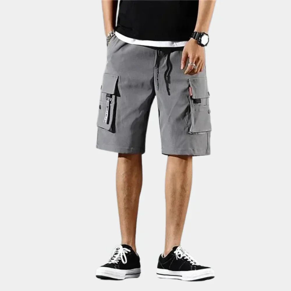 Fitlybuy grey cotton cargo shorts with a loose ComfortFlex fit, drawstring waist, and functional multi-pocket design.