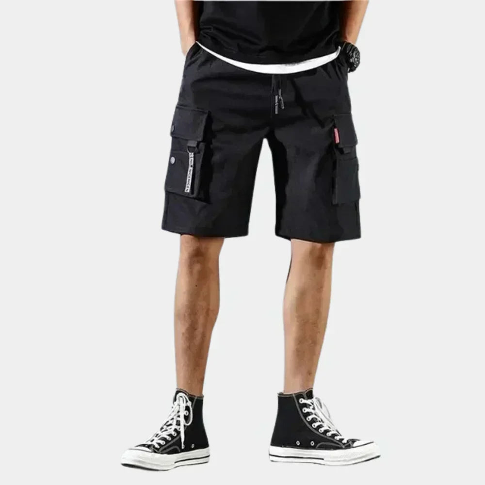 Fitlybuy black cotton cargo shorts with ComfortFlex loose fit, drawstring waist, and multiple side utility pockets.