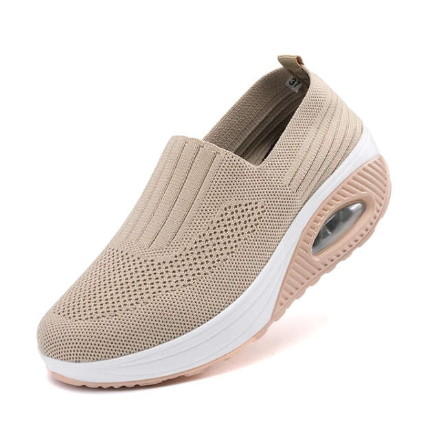 Beige, slip-on Fitlybuy women’s orthopedic shoe with breathable mesh knit, white sole, and ComfortGrip air cushion.