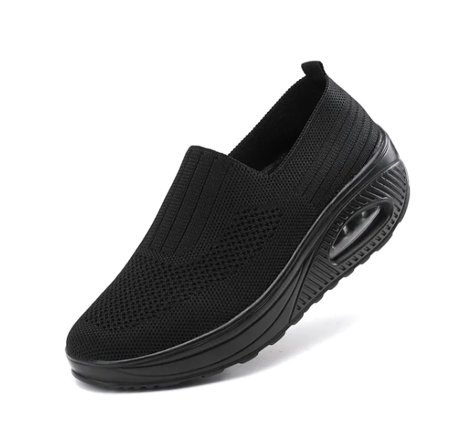 Fitlybuy black orthopedic slip-on sneaker featuring a breathable knit upper and cushioned, non-slip air-sole heel.