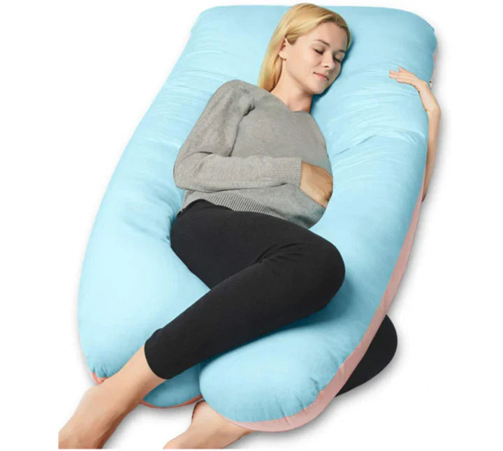 Woman sleeping on a light blue, U-shaped Fitlybuy pregnancy body pillow providing full-body support on white background.