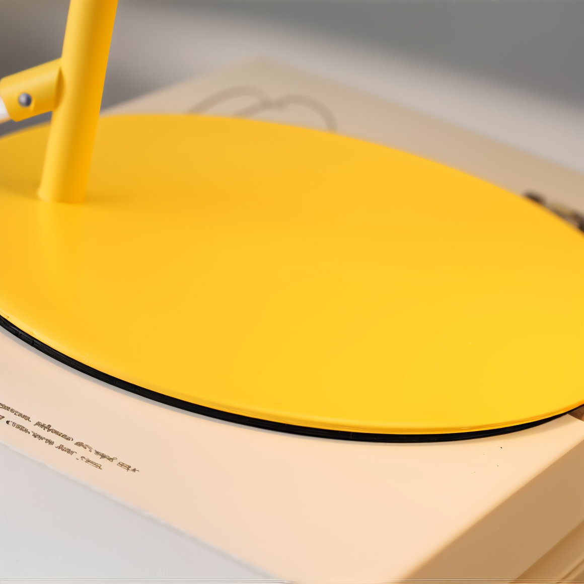 Bright yellow Fitlybuy Macaron desk lamp with adjustable neck, resting on a white, text-printed surface.