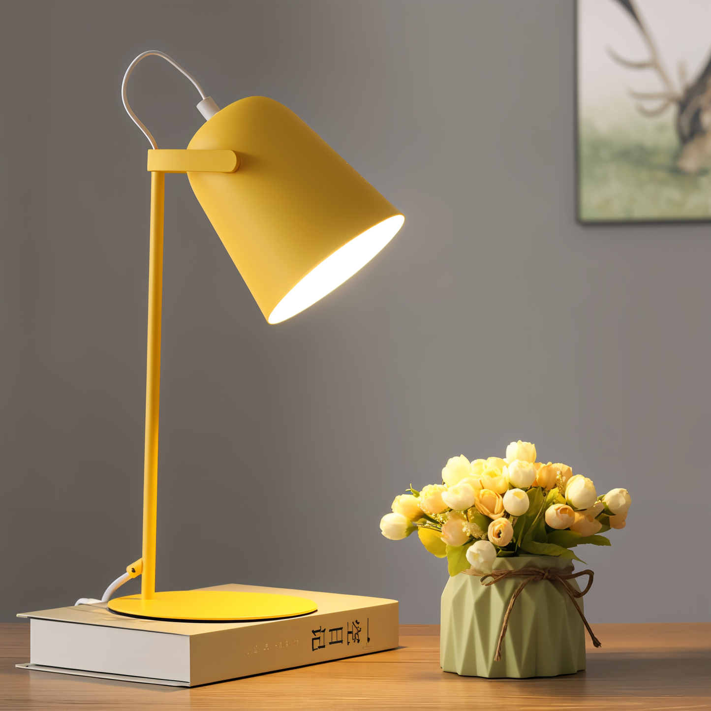 Fitlybuy Nordic yellow adjustable desk lamp on a book next to a small flower pot on a wooden surface.