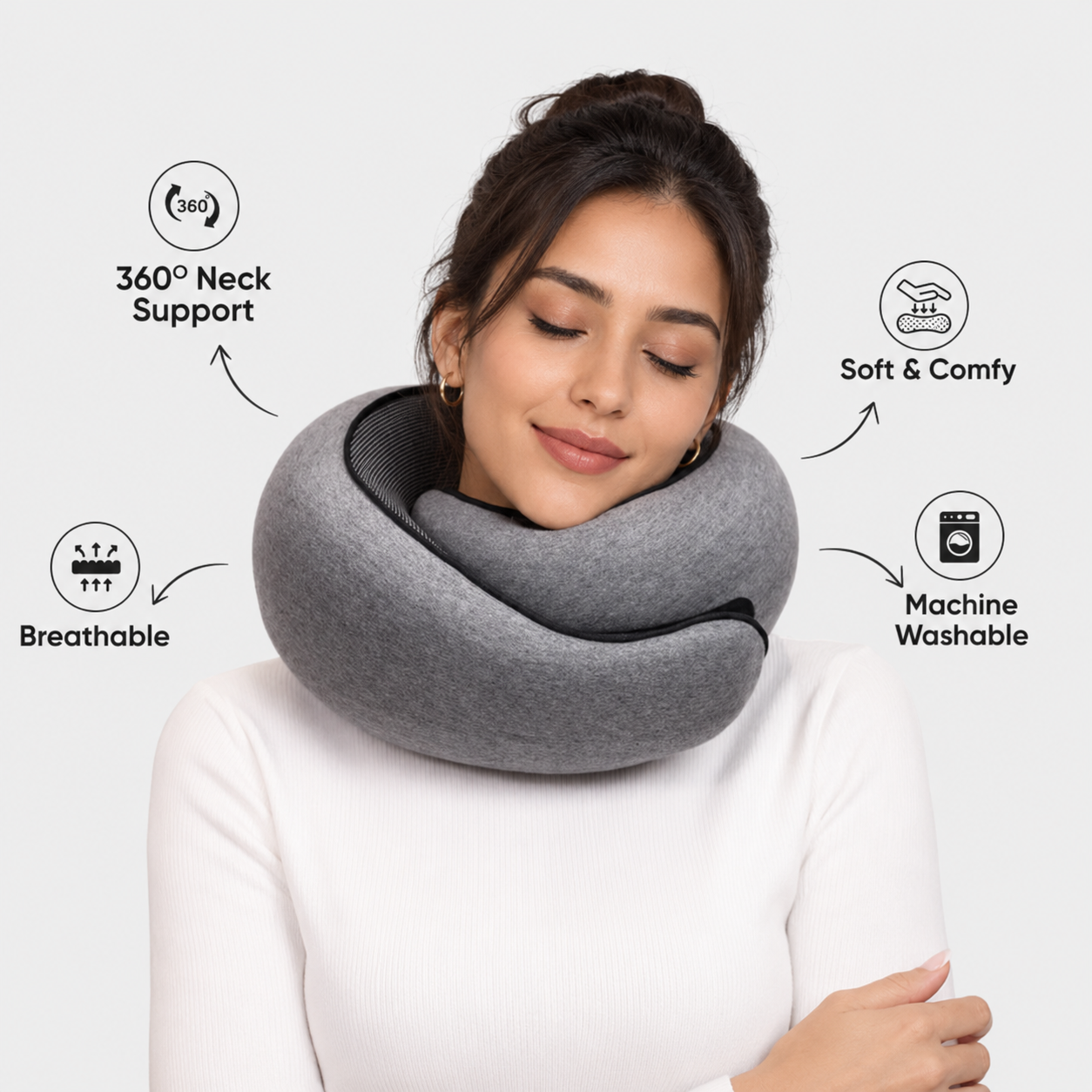 Woman wearing a gray Fitlybuy butterfly travel neck pillow with icons for 360-degree support, breathability, and comfort.