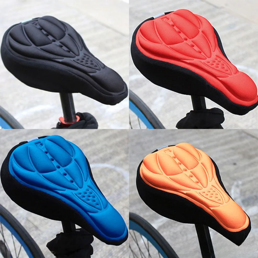 Four Fitlybuy ComfortRide gel bike seat covers in black, red, blue, and orange, mounted on bicycle seats.