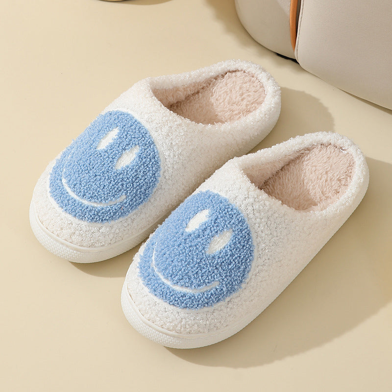 Fitlybuy white plush slippers with blue smiley face accents, soft memory foam lining, and a comfortable round-toe design.