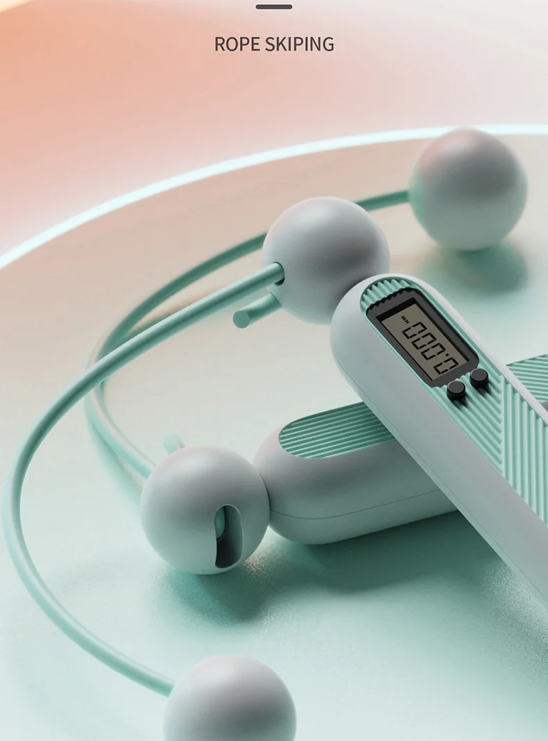 Fitlybuy cordless digital skipping rope in light green with SmartTrack display screen, shown on a smooth surface.