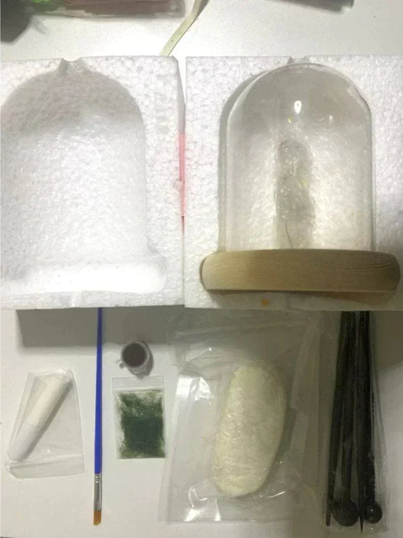 Fitlybuy DIY mushroom glass lamp kit with dome, wood base, paint, moss, tools, and clay in protective foam packaging.