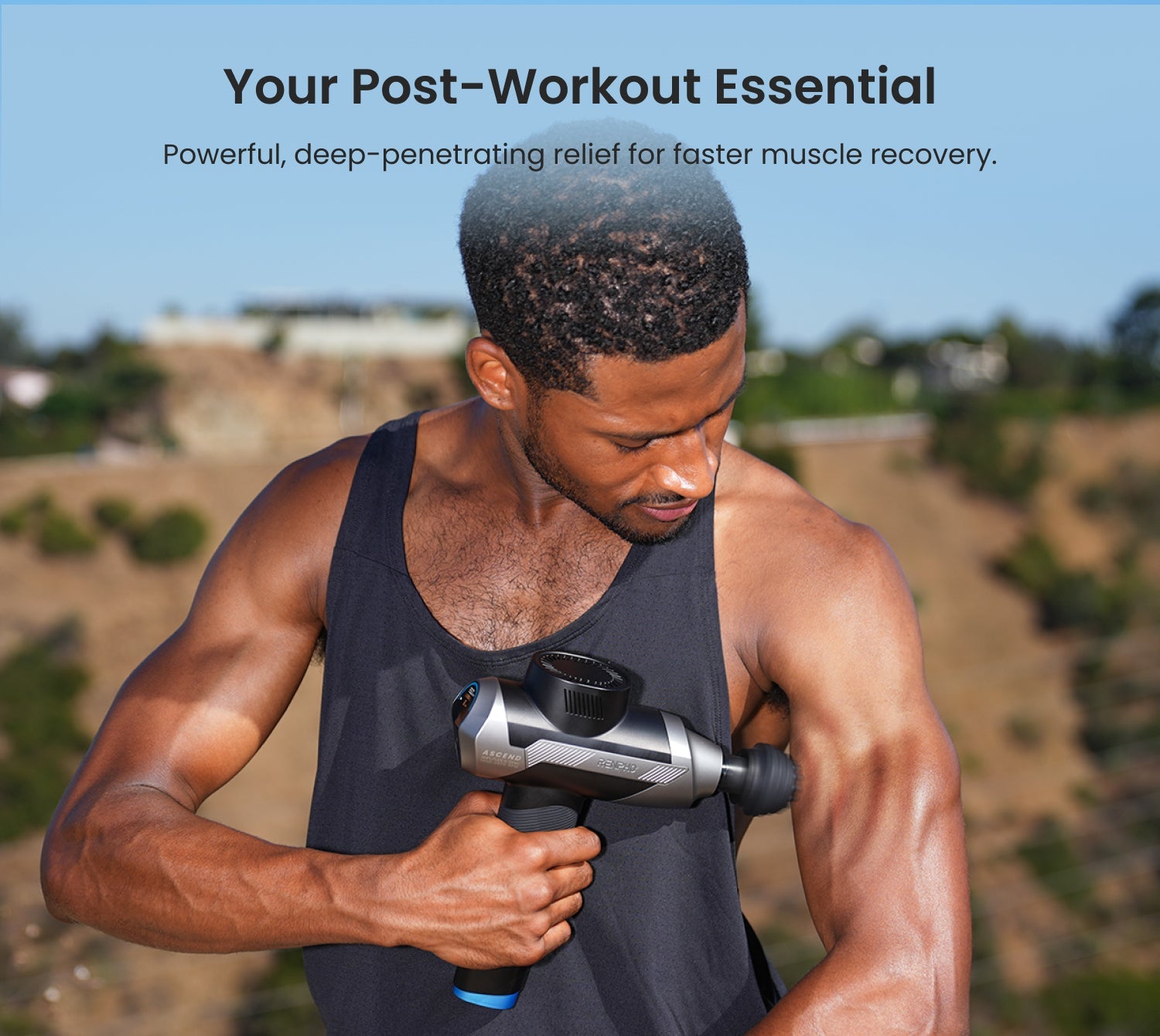 Fitlybuy Ascend grey massage gun with HyperPulse technology being used by a man on his arm for post-workout recovery.