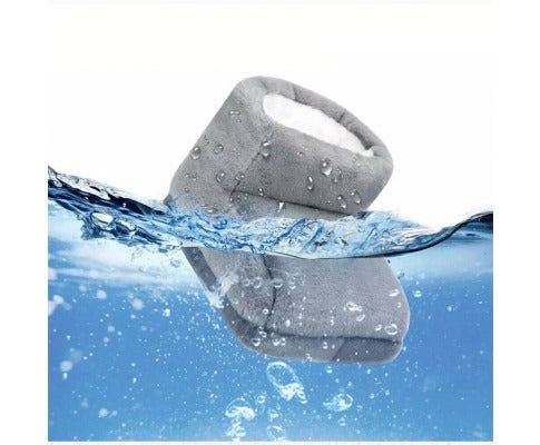 Grey Fitlybuy electric heated foot warmer with plush interior partially submerged in water to show water resistance.