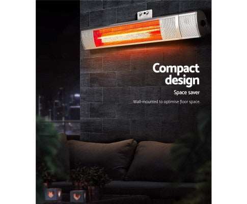 Fitlybuy 2000W infrared radiant heater mounted on a dark brick wall, glowing orange, designed for outdoor spaces.