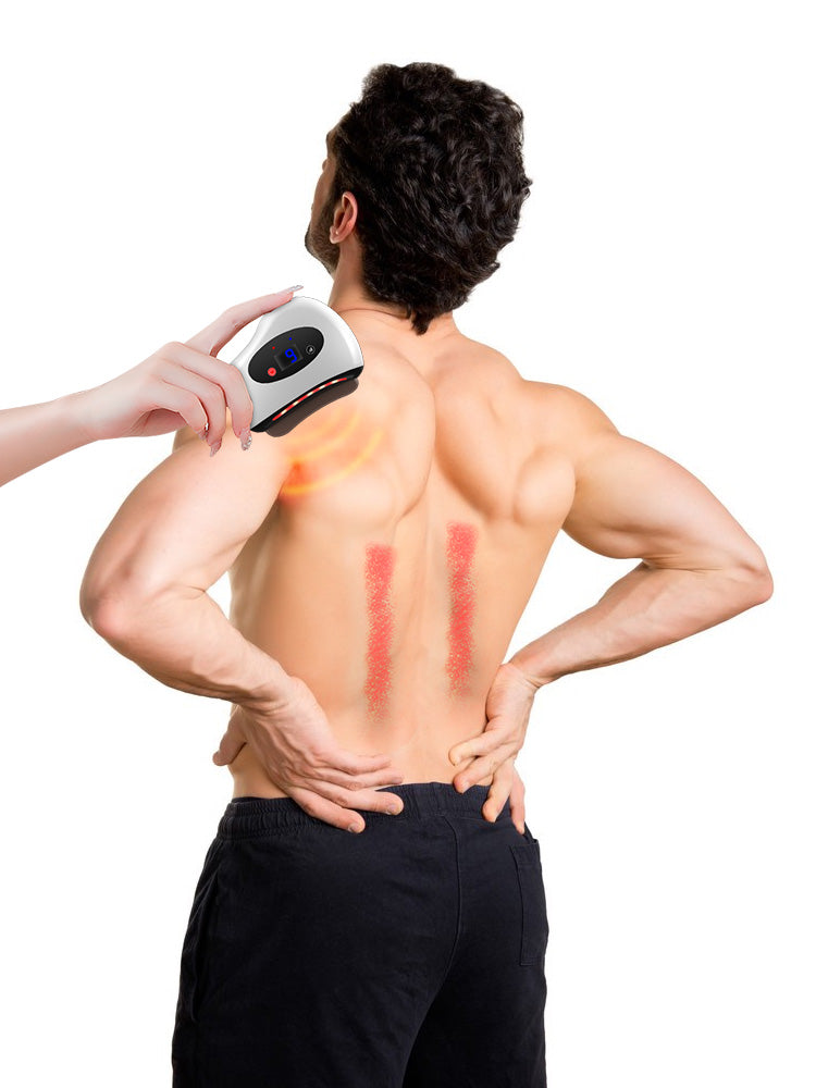 Hand holds a white Fitlybuy electric Guasha massager with heat therapy on a man's back, showing red heat zones.
