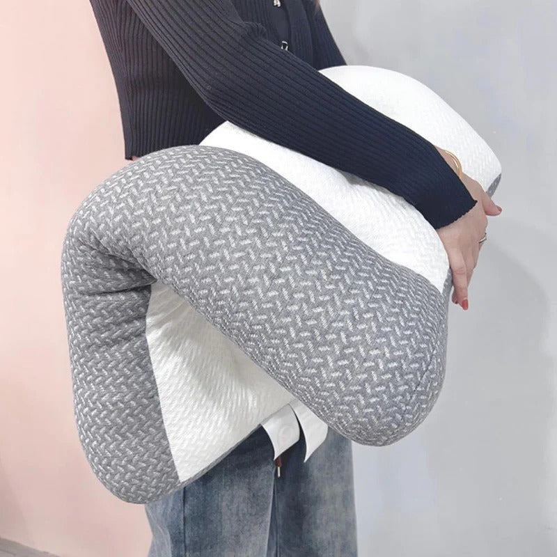 Person holding a flexible, two-tone grey and white ergonomic Fitlybuy pain relief pillow with textured fabric.