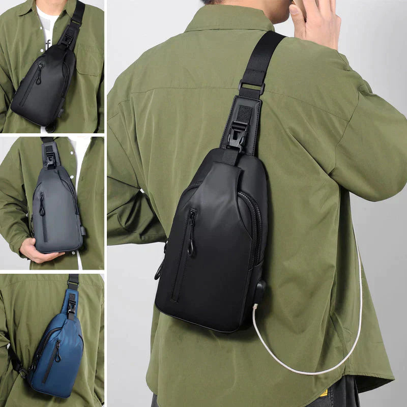 Fitlybuy black waterproof anti-theft crossbody bag with SecureLock and USB charging port worn over an olive shirt.