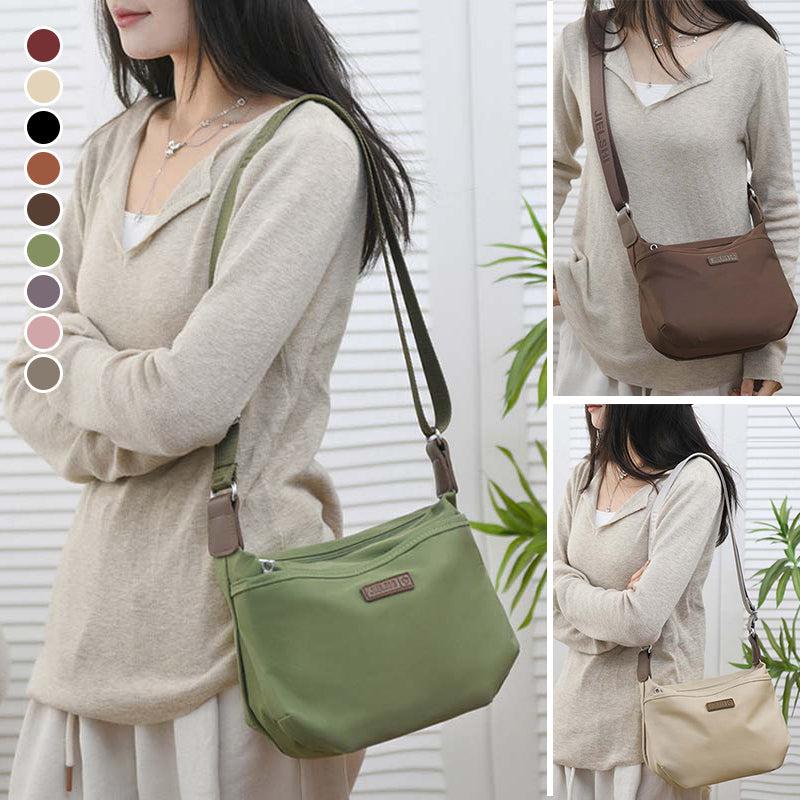 Woman wearing Fitlybuy Joanna anti-theft waterproof crossbody bag, available in various colors with adjustable strap.