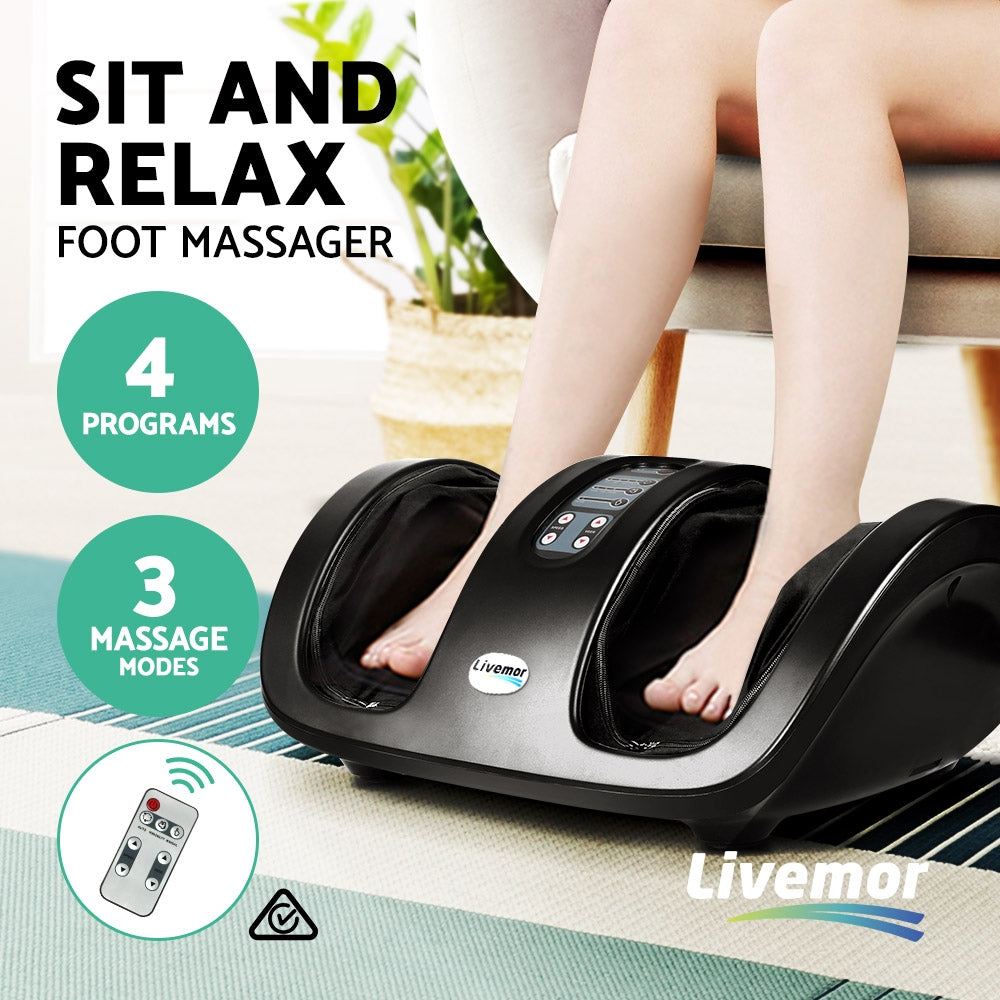 Black Livemor foot massager with deep tissue technology, 4 programs, 3 modes, and remote, used while sitting.