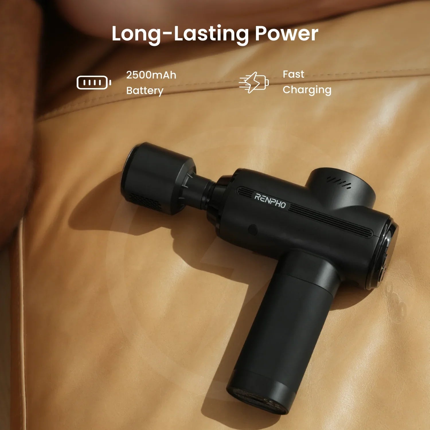 Black Renpho massage gun on leather surface, highlighting long-lasting 2500mAh battery and fast charging features.