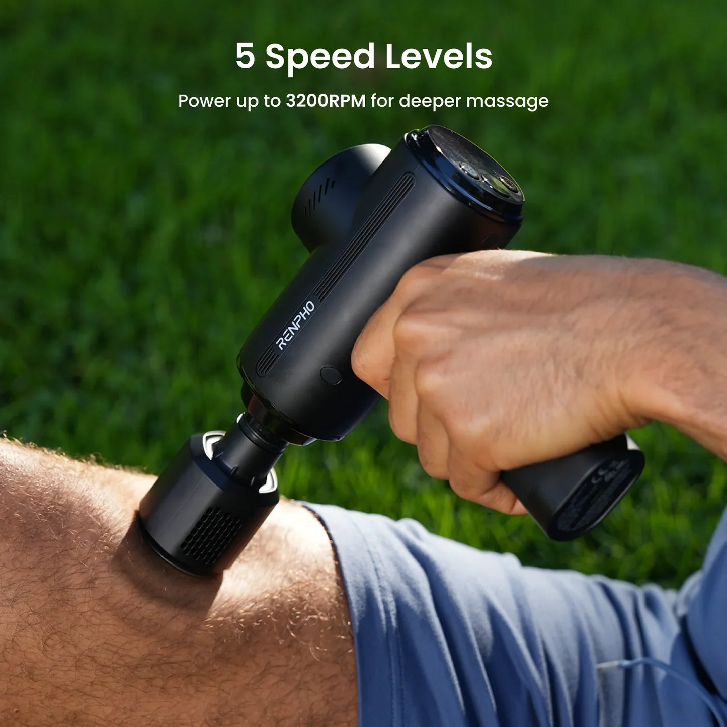 Black Fitlybuy Thermacool massage gun held against a leg outdoors, showing 5 speed levels up to 3200RPM.