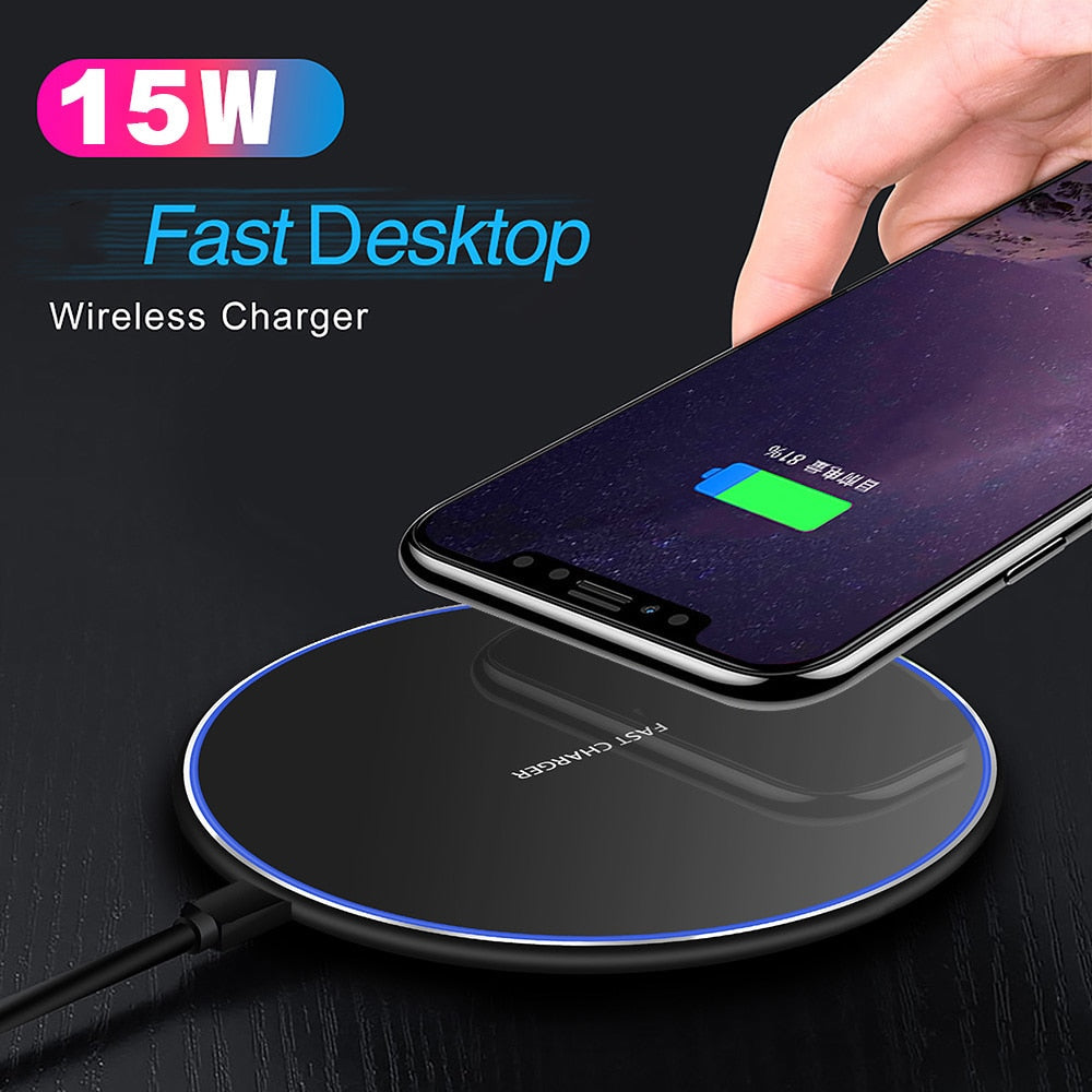 Black circular Fitlybuy wireless charging pad with blue glowing ring, charging a smartphone, labeled 15W fast charger.