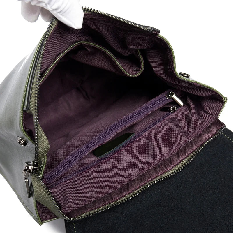 Open olive-green leather Fitlybuy backpack interior, showing deep purple lining, zippered pocket, and durable zippers.