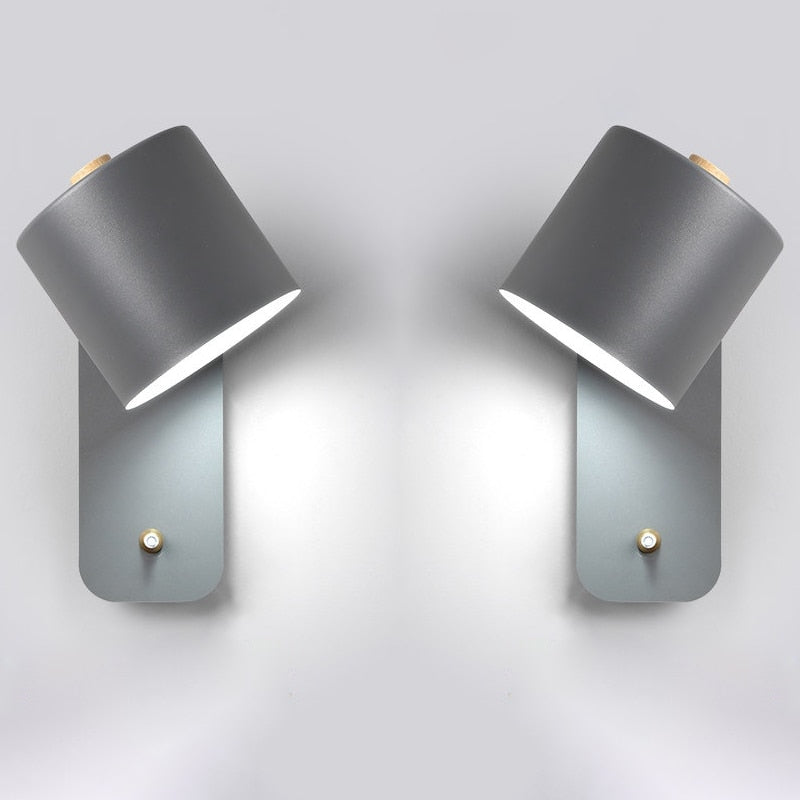 Two modern gray cylindrical LED wall lights with wood accents and built-in smart switches on a plain white background.
