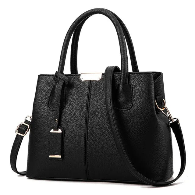 Black textured PU leather Fitlybuy handbag with top handles, detachable crossbody strap, and gold metal accents.