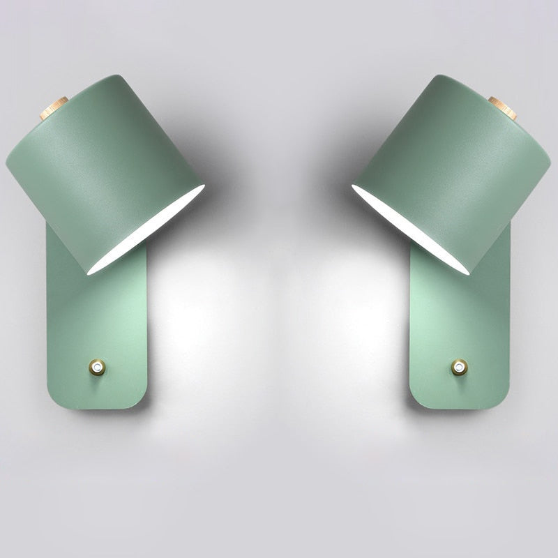 Two sage green modern LED wall lights with integrated smart switches, mounted against a plain white background.