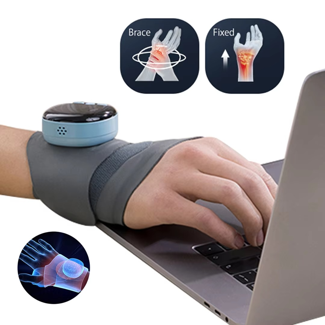 Fitlybuy grey EMS heating wrist brace worn while typing on a laptop, featuring thermo-therapy and tendon relief diagrams.